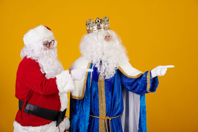 Rear view of woman holding christmas tree