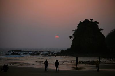 Silhouette of people on beach