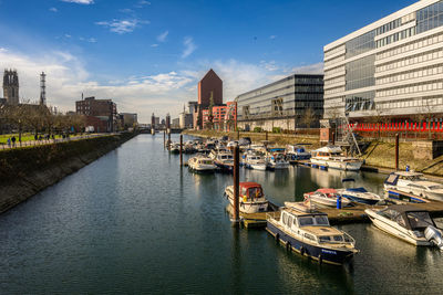 Boats moored at harbor