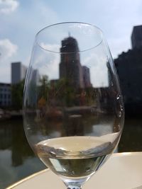 Close-up of beer in glass against sky