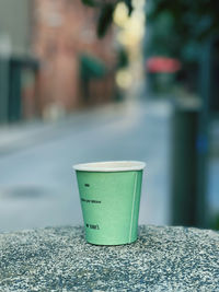 Close-up of coffee cup on table