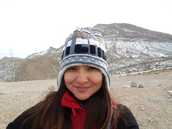 Portrait of smiling woman in snow