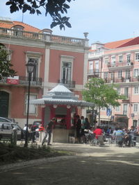 People in city against clear sky