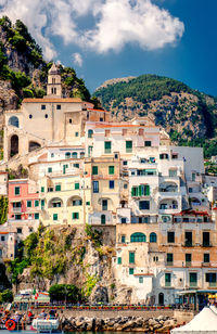 Low angle view of buildings against mountains