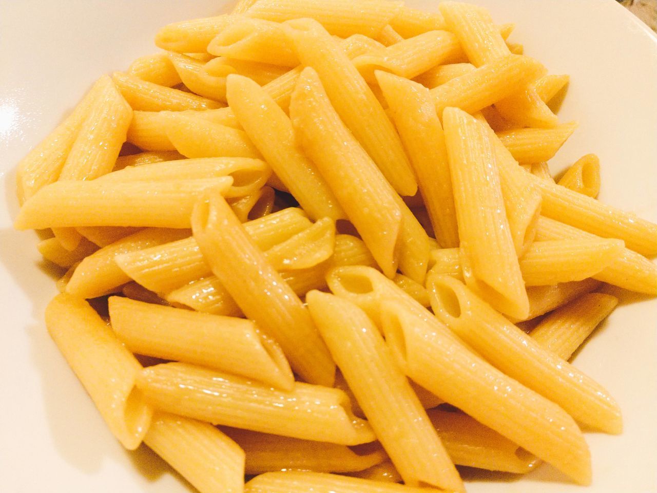 CLOSE-UP OF PASTA WITH FRIES AND YELLOW AND WHITE