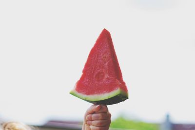 Close-up of hand holding ice cream