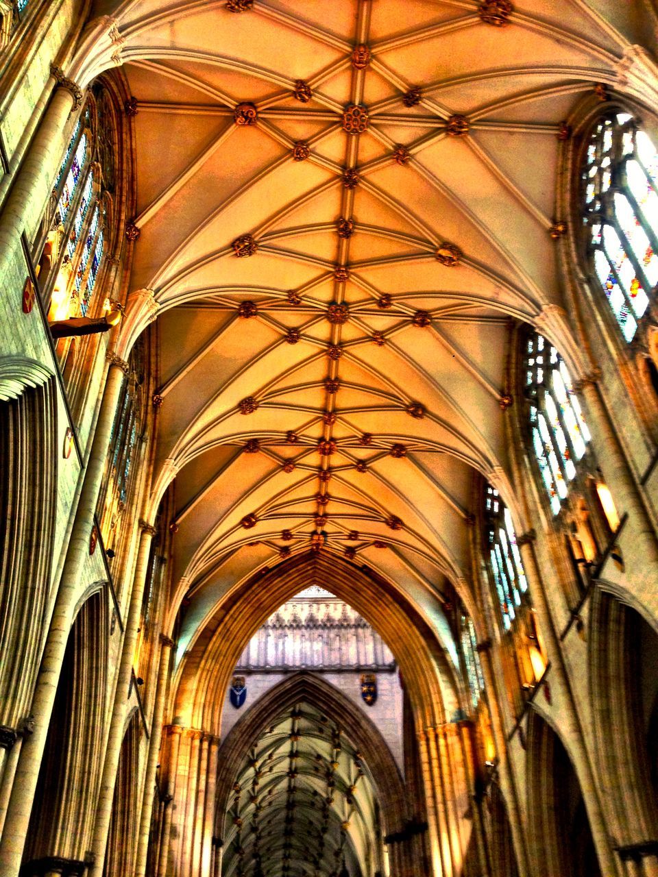 architecture, built structure, low angle view, indoors, arch, ceiling, architectural feature, interior, ornate, design, pattern, window, place of worship, religion, architectural column, history, church, building exterior, famous place, spirituality