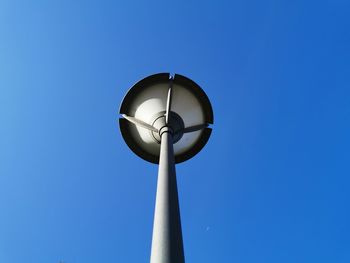 Low angle view of street light against clear blue sky