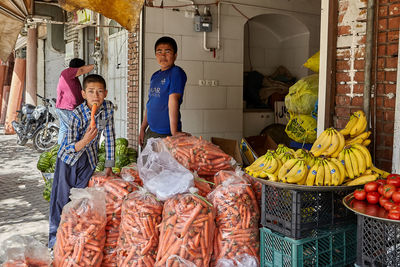 People standing in market stall