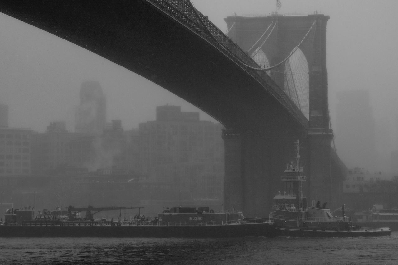 built structure, architecture, water, transportation, bridge, building exterior, bridge - man made structure, connection, river, city, sky, waterfront, fog, nature, nautical vessel, no people, mode of transportation, day, outdoors, cityscape, bay