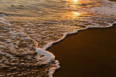 High angle view of surf on beach