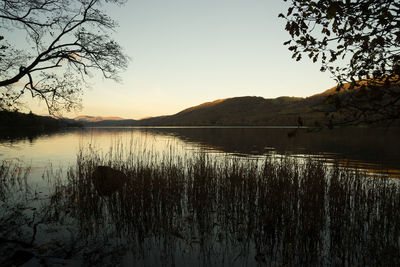Scenic view of lake during sunset