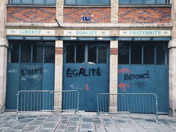 Text on brick wall