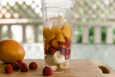 Close-up of fruits in jar on table