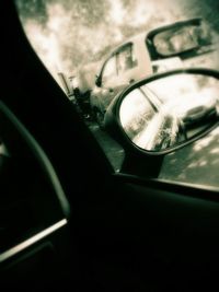 Close-up of car on road