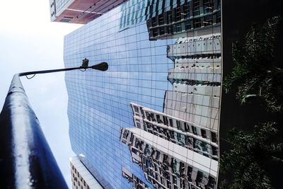 Low angle view of modern buildings against sky