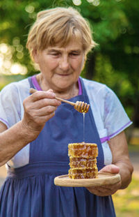 Midsection of woman eating food