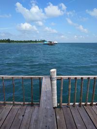 Pier over sea against sky