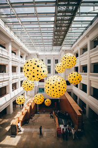 Low angle view of people in ceiling