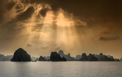 Scenic view of sea against cloudy sky