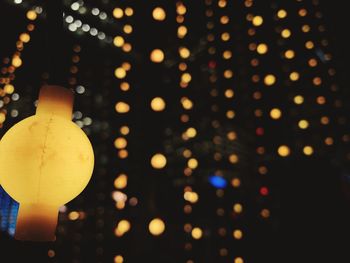 Close-up of illuminated christmas lights at night