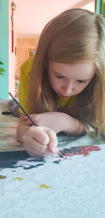 Portrait of a girl holding paper