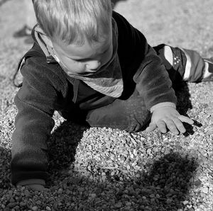 High angle view of boy playing on land