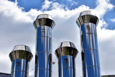 Low angle view of industrial building against sky