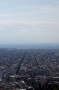 Aerial view of cityscape against sky