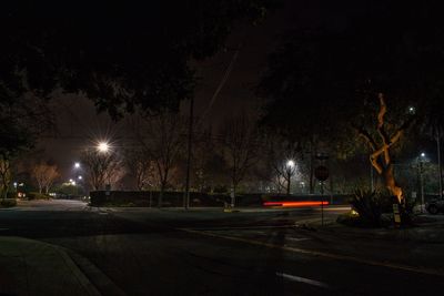 Empty road in city at night