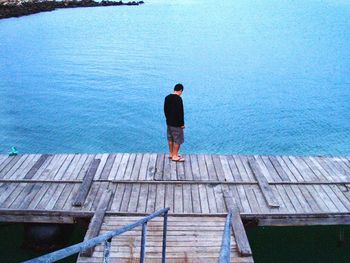 Rear view of man on water