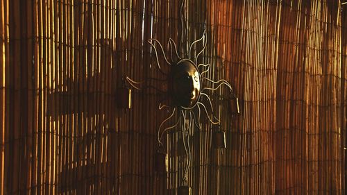 Full frame shot of bamboo hanging on metal wall