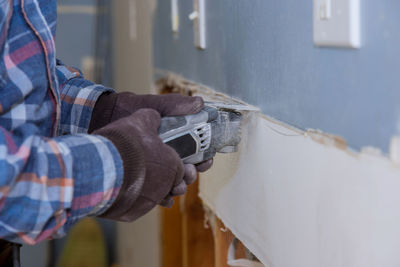 Man working on wall