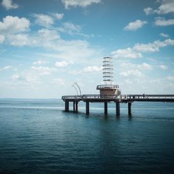 Scenic view of sea against cloudy sky