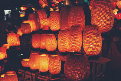 Close-up of illuminated lanterns for sale in market