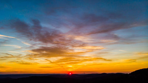 Scenic view of dramatic sky during sunset