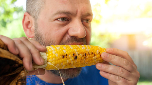 Portrait of man holding ice cream