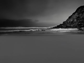 Scenic view of sea against sky at dusk