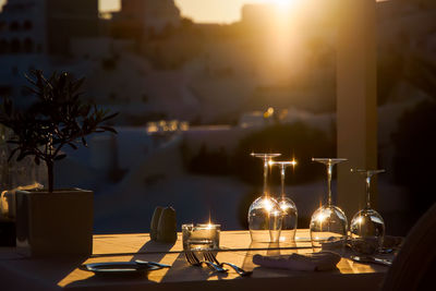 View of wine glasses on table at restaurant at night