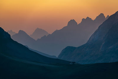 Scenic view of mountains against sky during sunset