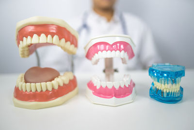 Dentist demondstate to use dental tool to clean teeth