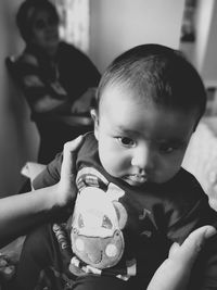 Portrait of boy holding camera