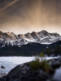 Scenic view of snowcapped mountains against sky during winter