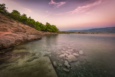 Scenic view of sea against sky at sunset