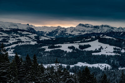 Scenic view of mountains against sky during winter