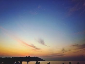 Scenic view of sea against sky at sunset