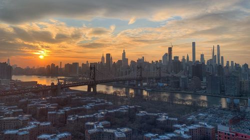 Modern buildings in city during sunset