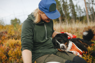 Smiling man stroking dog