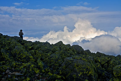 Scenic view of landscape against cloudy sky