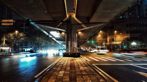 Illuminated city street at night